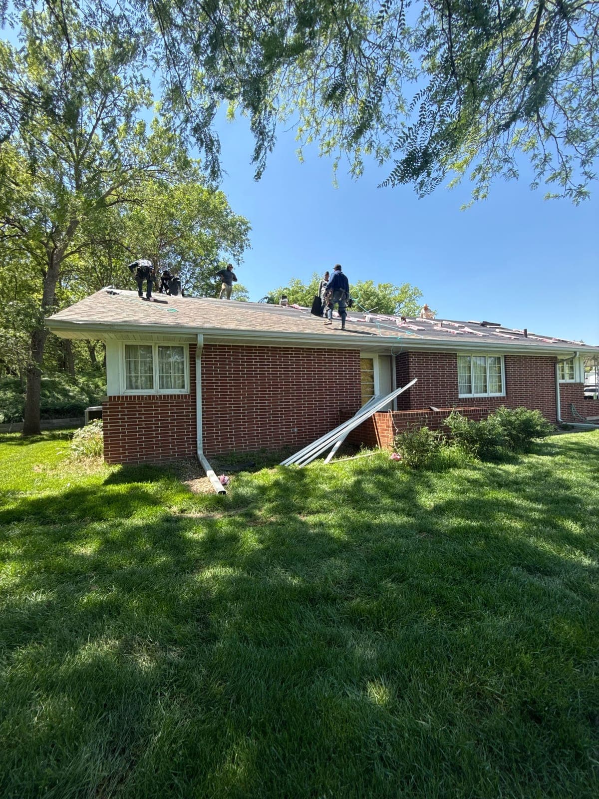 Crew member installing a roof